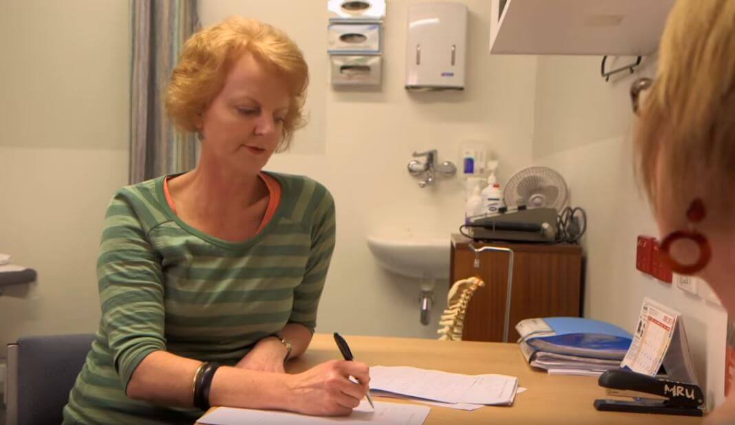 Liz Childs talks to a patient with a prolapse