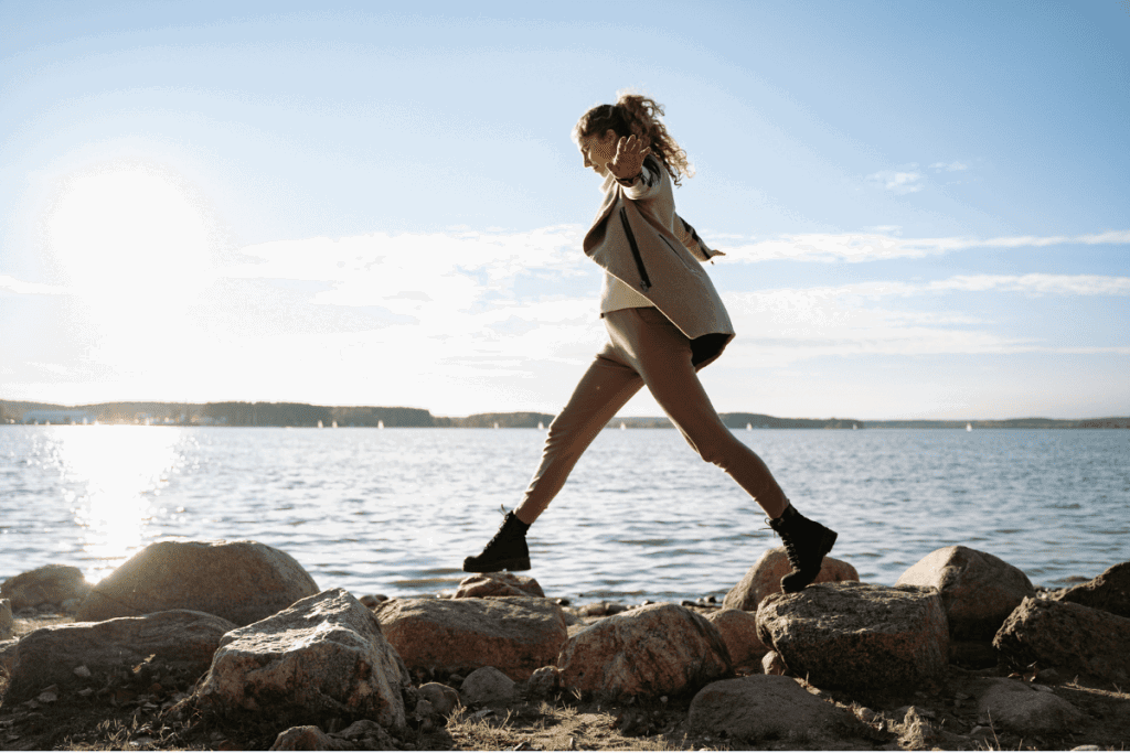 Woman walking along the rocks on Wellington waterfront - using a pesssary for prolapse
